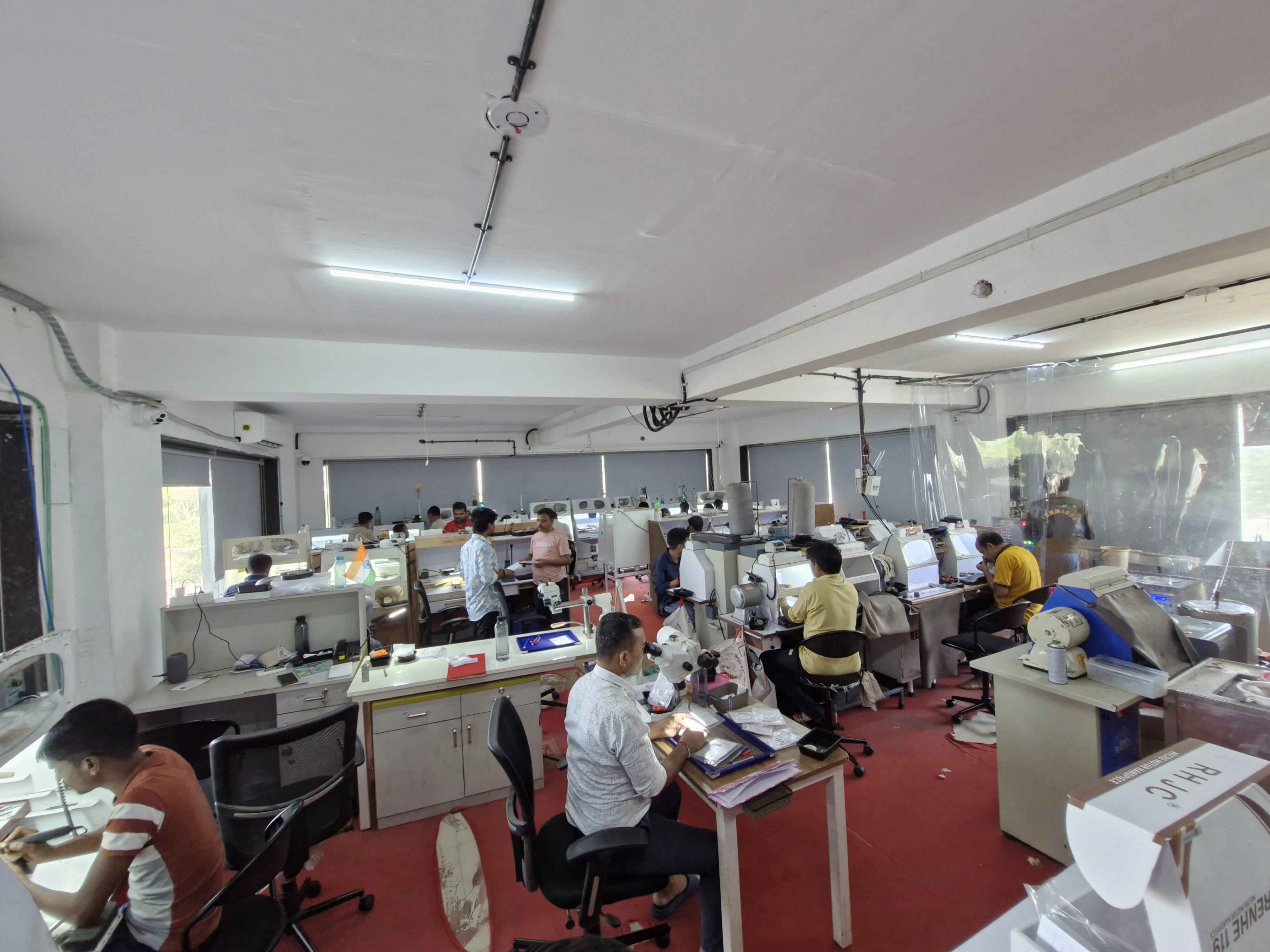 Skilled artisan handcrafting jewelry at Ami Jewels manufacturing facility